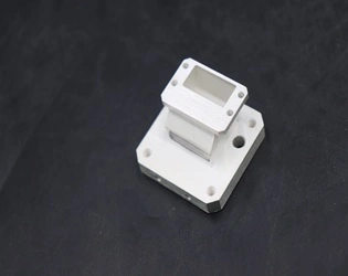 Why is the E bend used in waveguides instead of other types of bends?